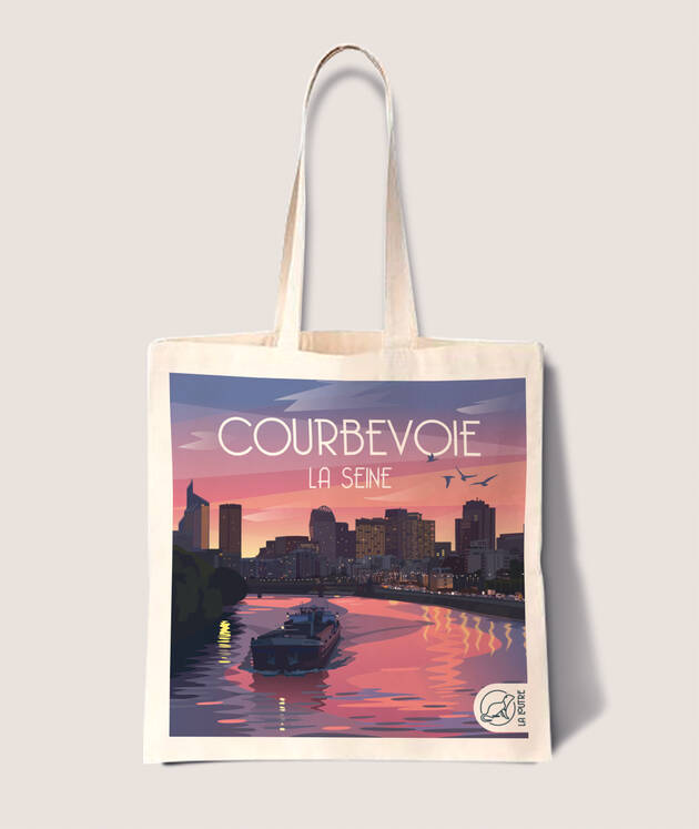 Photo du tote bag "Courbevoie La Seine" avec un visuel de La Défense et de la Seine travaillé en illustration